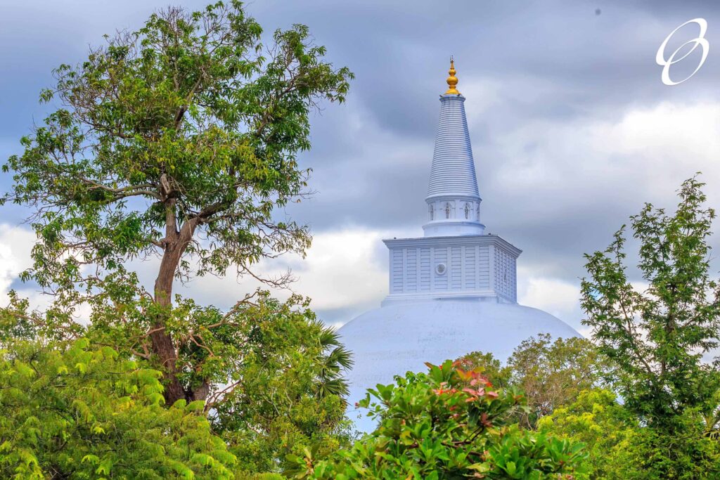 Scenic view of Ruwanwelisaya white stupa on jungle background in Anuradhapura, Sri Lanka