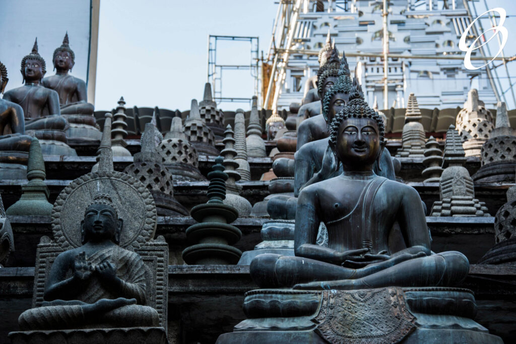 The Buddha statues and small stupas in Gangaramaya temple, Colombo, Sri Lanka.