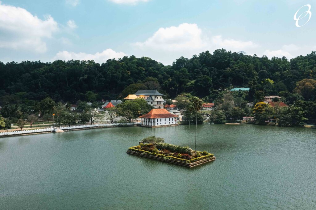 Skyline aerial drone view of Kandy lake and temple, stunning place in the heart of Kandy city in Sri Lanka. Famous historical and Buddhism landmark Sri Dalada Maligawa, Sacred Tooth Relic of Temple