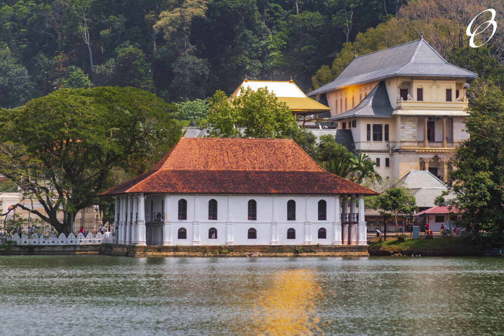 Kandy lake and the temple, a beautiful stunning place in the heart of Kandy city in Sri Lanka. Famous historical and Buddhism landmark Sri Dalada Maligawa, Sacred Tooth Relic of the Temple