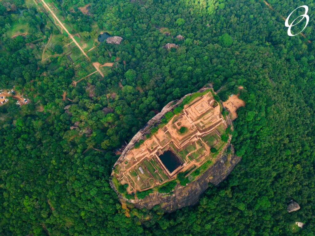 Aerial view of Sigiriya rock at misty morning, Sri Lanka. Drone footage.