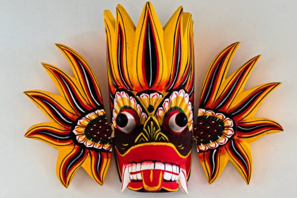 The purpose of the mask is to ward off evil. This mask represents the emotional anger, which is why the colours red, orange and yellow are